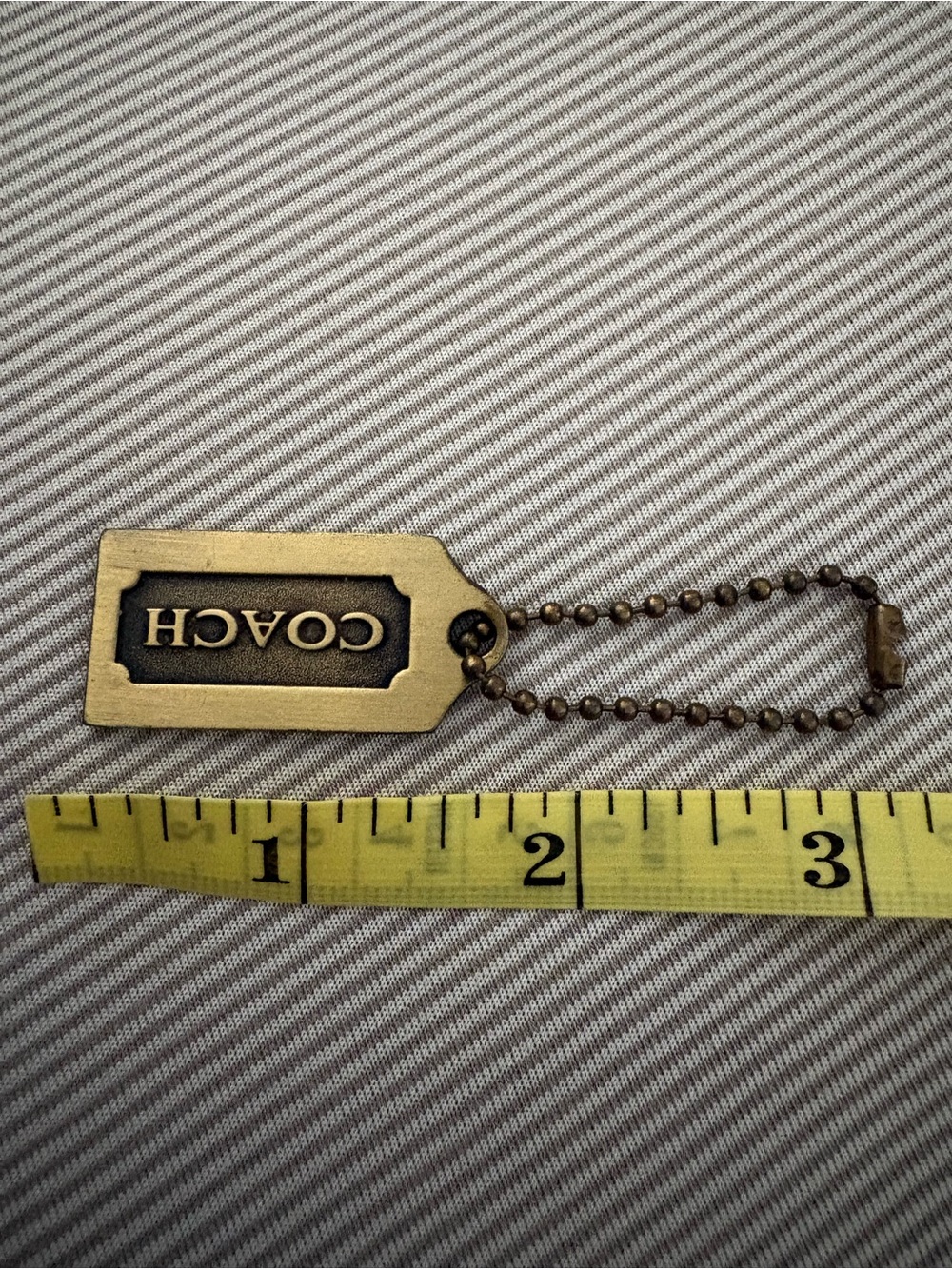 Coach Brass/Antique Gold hangtag - Picture 2 of 3